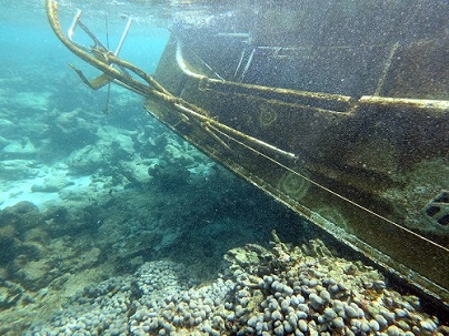 A derelict sailing vessel aground on Long Reef off St. Croix